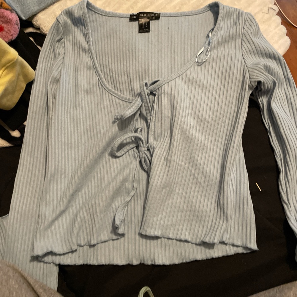 Blue long sleeve that lies in the front